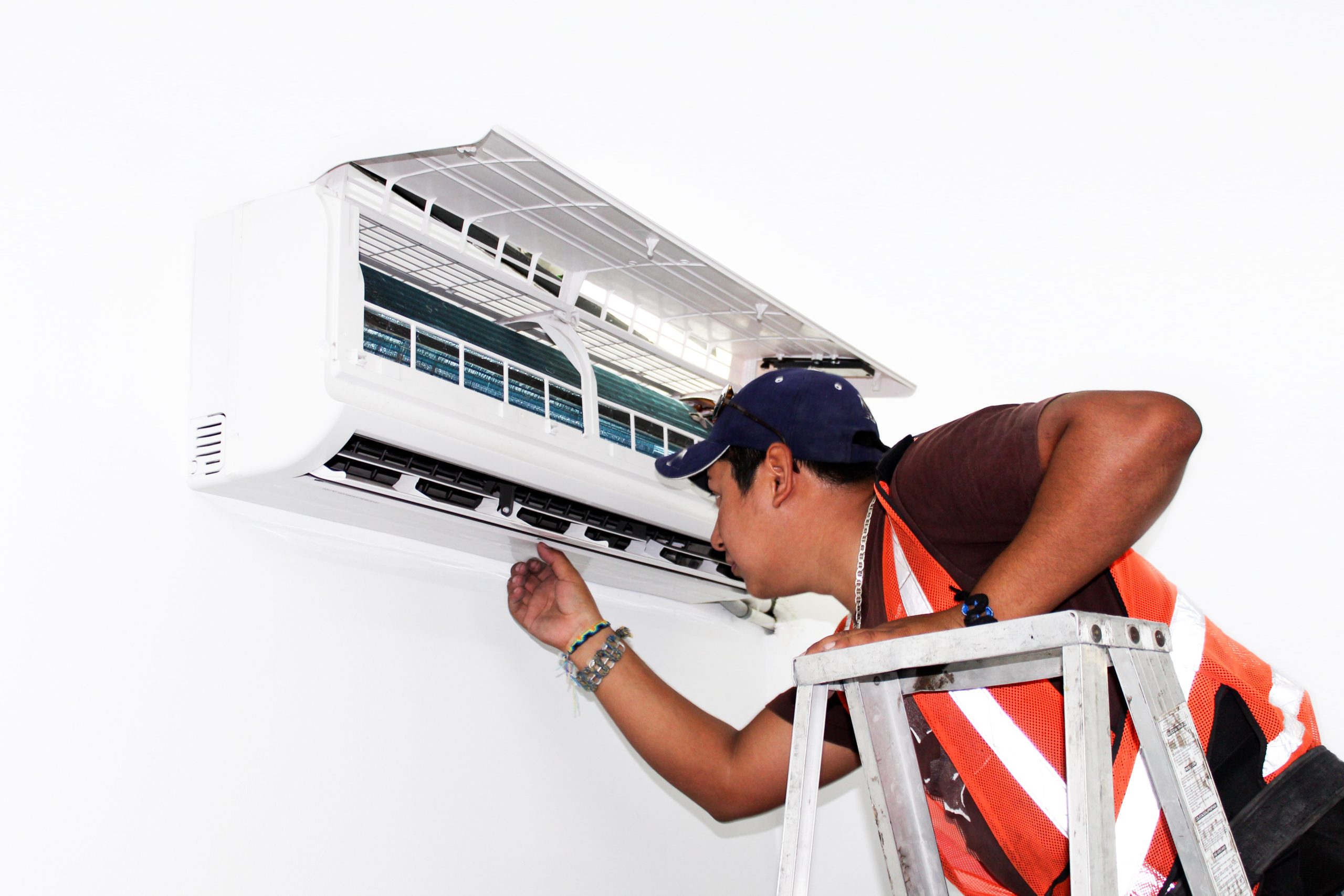 AC Repair expert looking at a unit in Los Angeles